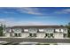 New townhome showcases a well-manicured lawn, attached garages, and neutral exterior paint at 2569 Penguin Blvd, Davenport, FL 33837