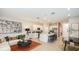 Open floorplan showcases the seamless flow from the living room to the modern kitchen at 2569 Penguin Blvd, Davenport, FL 33837