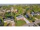 An aerial view shows the home's well-manicured lawn surrounded by lush greenery at 1841 5Th Se St, Winter Haven, FL 33880