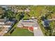 Aerial view of a single-Gathering home with mature trees and manicured landscaping at 1841 5Th Se St, Winter Haven, FL 33880