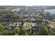 An aerial view shows the charming home nestled in a suburban neighborhood close to town at 1841 5Th Se St, Winter Haven, FL 33880