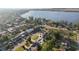 Aerial view of a single story home featuring a well manicured lawn and mature trees at 1841 5Th Se St, Winter Haven, FL 33880