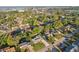An aerial view highlights the neighborhood's tree-lined streets and nearby amenities at 1841 5Th Se St, Winter Haven, FL 33880