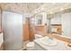 Bathroom featuring a glass-door shower, toilet, and a sink with vanity at 1841 5Th Se St, Winter Haven, FL 33880