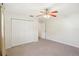Bedroom features carpet, closet and ceiling fan at 1841 5Th Se St, Winter Haven, FL 33880