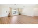 Bright, empty living room with light wood floors and natural light at 1841 5Th Se St, Winter Haven, FL 33880