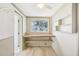 Room featuring built in shelves and desk with wood look flooring at 1841 5Th Se St, Winter Haven, FL 33880