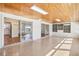 Spacious sunroom features a wood ceiling, plenty of sunlight, and access to kitchen at 1841 5Th Se St, Winter Haven, FL 33880