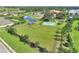 Aerial view of a large dog park and recreational area with a basketball court at 474 Del Sol Ave, Davenport, FL 33837