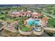 Aerial view showcasing the community pool, clubhouse, and lush landscaping at 474 Del Sol Ave, Davenport, FL 33837