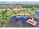 Aerial view of community clubhouse, pool, dock, and the surrounding area at 474 Del Sol Ave, Davenport, FL 33837
