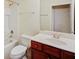 Well-lit bathroom features a vanity with storage and a shower-tub combination at 474 Del Sol Ave, Davenport, FL 33837