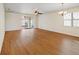 Expansive living room featuring wood floors, a ceiling fan, and sliding glass doors to the outdoors at 474 Del Sol Ave, Davenport, FL 33837