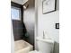 Bathroom with dark tile, shower and tub combination, and modern fixtures at 14110 Sapphire Bay Cir, Orlando, FL 32828