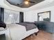 Spacious main bedroom featuring dark wood floors and dresser and natural light at 14110 Sapphire Bay Cir, Orlando, FL 32828