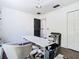 Home office featuring a contemporary desk, modern chair, and chic black and white rug at 14110 Sapphire Bay Cir, Orlando, FL 32828