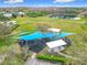 Aerial view of a fun community playground with colorful shade canopies, swings, and playground equipment at 14110 Sapphire Bay Cir, Orlando, FL 32828