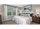 Comfortable bedroom featuring a queen-sized bed and neutral decor at 2557 Penguin Blvd, Davenport, FL 33837