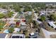 Aerial view showcasing a home with a private pool, mature landscaping, and convenient access to neighborhood amenities at 4089 Lehman Ln, Lakeland, FL 33813