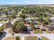 Aerial view showcasing a lovely home in a tranquil neighborhood with mature trees and well-maintained surrounding properties at 4089 Lehman Ln, Lakeland, FL 33813