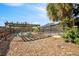 Backyard with wooden pergola, sitting area, and view of the screened pool, ideal for outdoor living at 4089 Lehman Ln, Lakeland, FL 33813