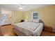 This bedroom features hardwood floors, neutral paint, overhead light and window at 4089 Lehman Ln, Lakeland, FL 33813