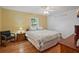 This bedroom features hardwood floors, neutral paint, overhead light and window at 4089 Lehman Ln, Lakeland, FL 33813