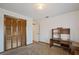 Bedroom with neutral carpet, a large closet, and a built-in wooden desk at 4089 Lehman Ln, Lakeland, FL 33813