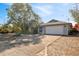 Well-maintained home with a two-car garage, brick driveway, and lush greenery, offering a welcoming curb appeal at 4089 Lehman Ln, Lakeland, FL 33813