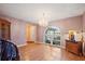 Living room featuring an arched window, wood floors, and chandelier at 4089 Lehman Ln, Lakeland, FL 33813