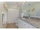 Bathroom featuring white cabinets and granite countertops at 540 Buckingham Cir, Davenport, FL 33897