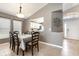 Dining room adjacent to the kitchen and front door, featuring tile floors and natural light at 540 Buckingham Cir, Davenport, FL 33897