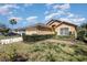 Inviting single-story home with well-maintained landscaping, a two-car garage, and a cozy front yard at 540 Buckingham Cir, Davenport, FL 33897