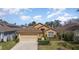 Charming one-story home with a well-manicured lawn, neutral color scheme and attached garage at 540 Buckingham Cir, Davenport, FL 33897