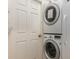 Laundry Room with stacked washer and dryer at 540 Buckingham Cir, Davenport, FL 33897