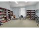 Community library featuring rows of books and comfortable seating for reading and studying at 540 Buckingham Cir, Davenport, FL 33897