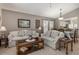 Comfortable living room featuring neutral colors, tile floors, and decorative accents for a welcoming atmosphere at 540 Buckingham Cir, Davenport, FL 33897