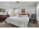 Comfortable main bedroom with ceiling fan, neutral walls and tile flooring at 540 Buckingham Cir, Davenport, FL 33897