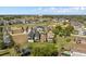 Aerial view of houses with golf course backdrop in a scenic residential neighborhood with lush landscaping at 1529 Euston Dr, Reunion, FL 34747