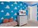 This playful bedroom features Toy Story-themed cloud walls and a smart TV at 1529 Euston Dr, Reunion, FL 34747