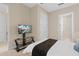 Bedroom with carpet, a large TV, a closet and an ensuite at 1529 Euston Dr, Reunion, FL 34747