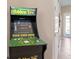 A fun Golden Tee arcade game adds a unique touch to this home's entertaining space at 1529 Euston Dr, Reunion, FL 34747