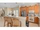 Kitchen featuring stainless steel appliances, modern cabinets, and breakfast bar seating at 1529 Euston Dr, Reunion, FL 34747