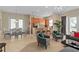 Bright living space featuring dining area and kitchen with breakfast bar; modern design at 1529 Euston Dr, Reunion, FL 34747