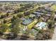 Aerial view showcasing tennis and pickleball courts, community pool and mini-golf area at 7636 Heritage Crossing Way, Reunion, FL 34747