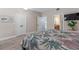 Bedroom with wood laminate flooring, ensuite bathroom, and large closet at 7636 Heritage Crossing Way, Reunion, FL 34747