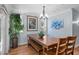 Light and bright dining room with a wooden table, bench seating, and natural light at 7636 Heritage Crossing Way, Reunion, FL 34747