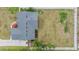 Aerial view of a house with a well maintained yard and a driveway leading to a two-car garage at 2155 Thompson Rd, Bartow, FL 33830
