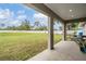 Covered patio offering an outdoor view of the expansive backyard at 2155 Thompson Rd, Bartow, FL 33830