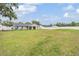 Expansive backyard showing the well-kept lawn and a white fence at 2155 Thompson Rd, Bartow, FL 33830